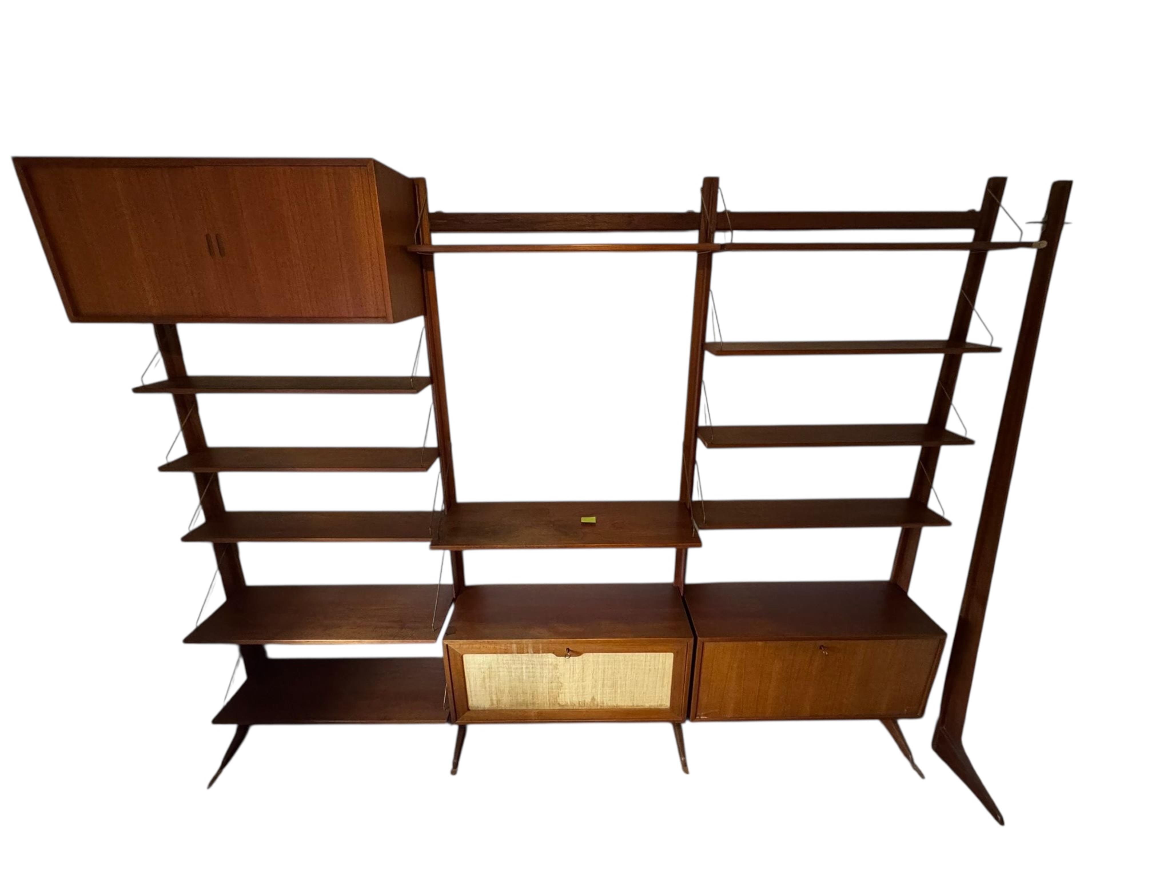 A mid century teak Ladderax type wall unit, width 270cm approx., depth 32cm, height 210cm